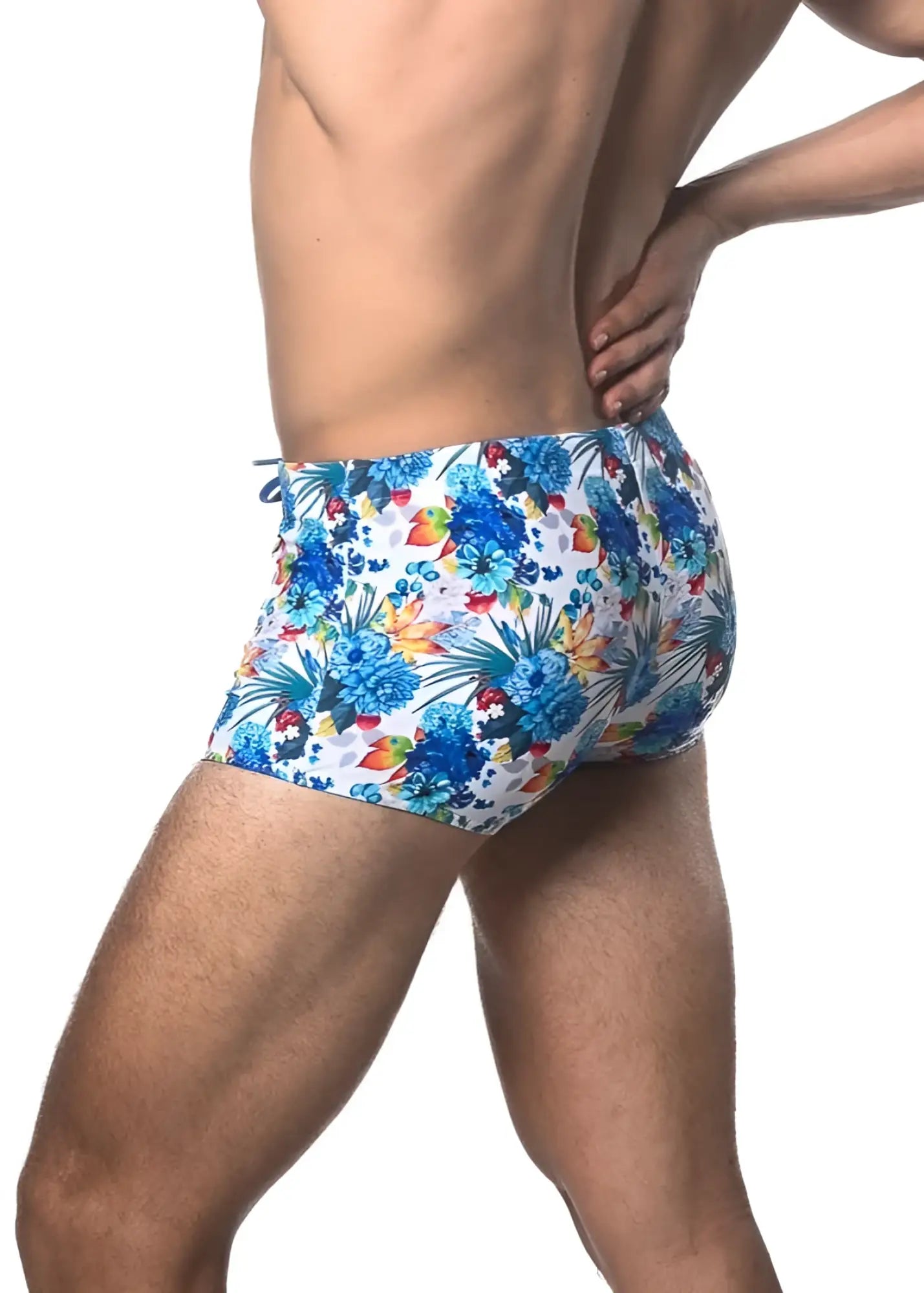 Tropics printed swim trunk with blue and multicolored tropical floral pattern perfect for beach and poolwear