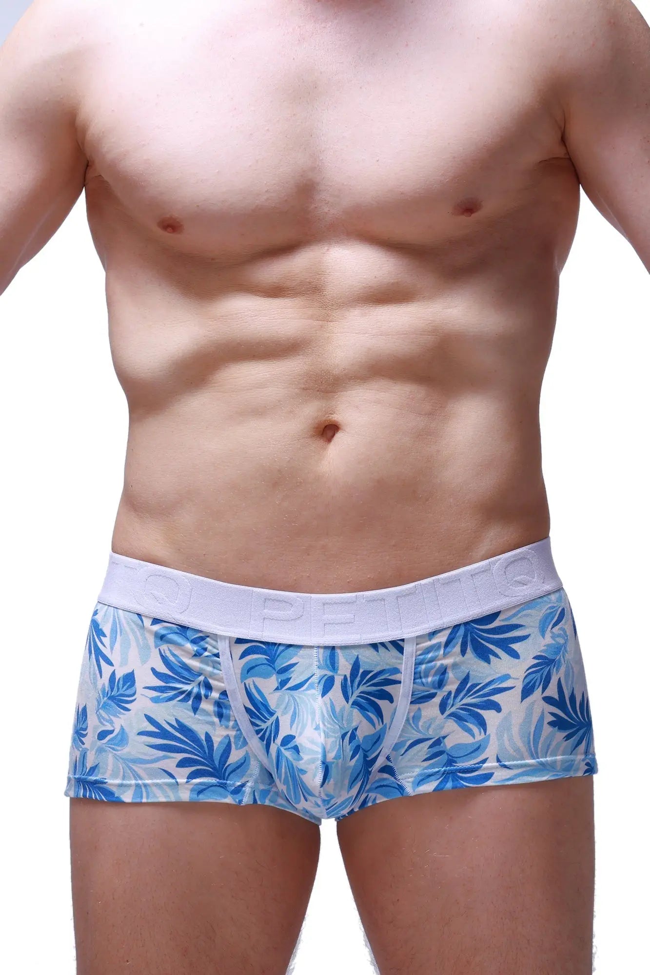 Blue and white tropical leaf patterned men’s boxer briefs trunk maeha with white petitq branded elastic waistband