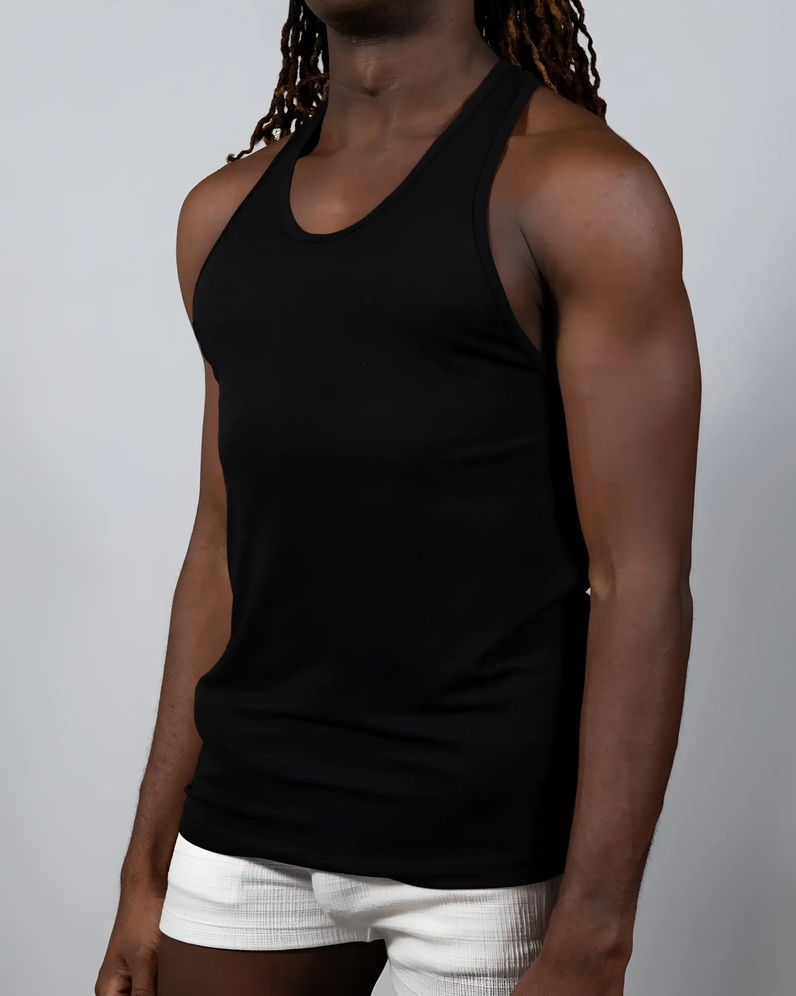 Black tulio solid tank racerback tank top with smooth fitted silhouette made of soft breathable fabric