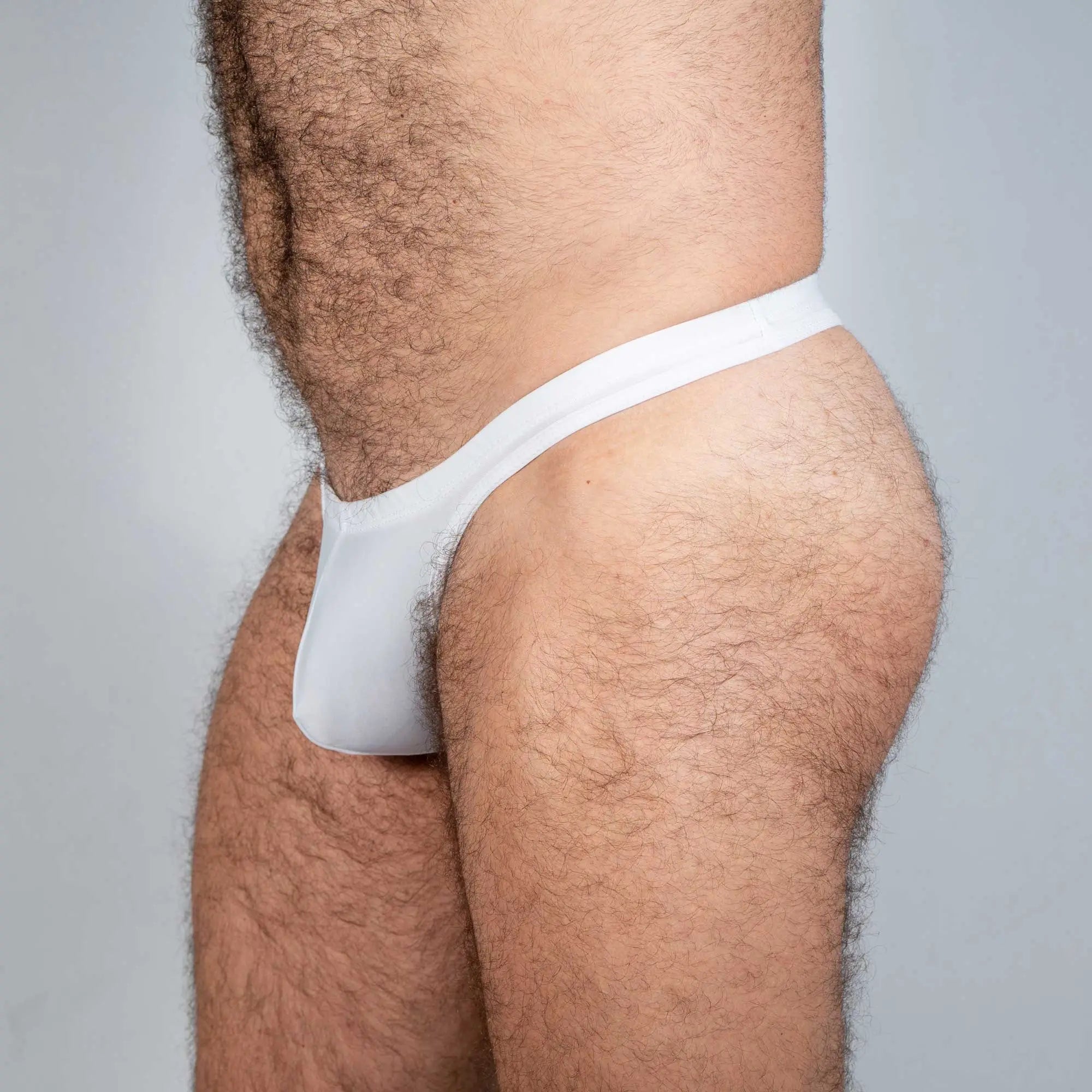 White cotton tulio swim thong briefs with a snug form-fitting design for comfortable swimwear use