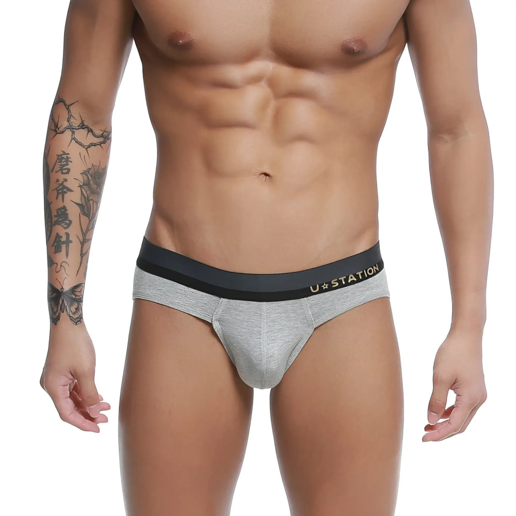 Gray heathered u-station adam briefs with black elastic waistband and gold logo for comfortable everyday wear