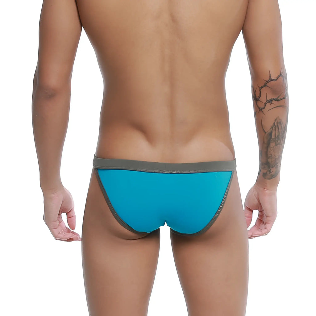 Bright blue u-station frisa bikini swim trunks with contrasting gray waistband for stylish beachwear
