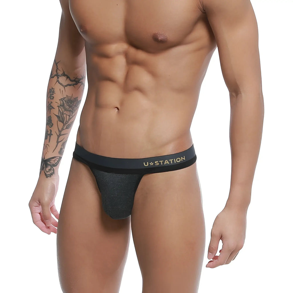 Black u station talent thong with subtle heathered texture and gold lettering on the waistband gray u0104-013