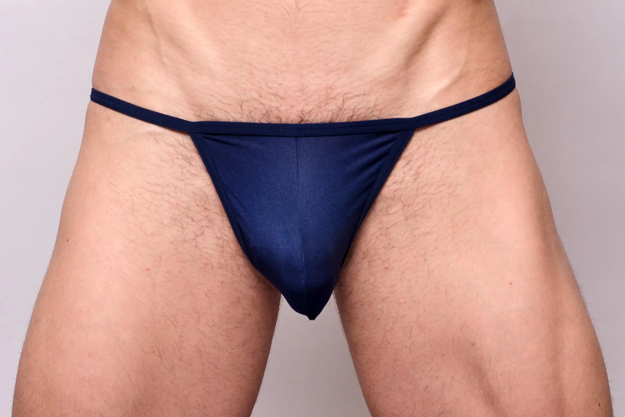 Navy blue thong from 3-pack pride metro string bikini made of smooth stretchable fabric with narrow waistband and minimal coverage