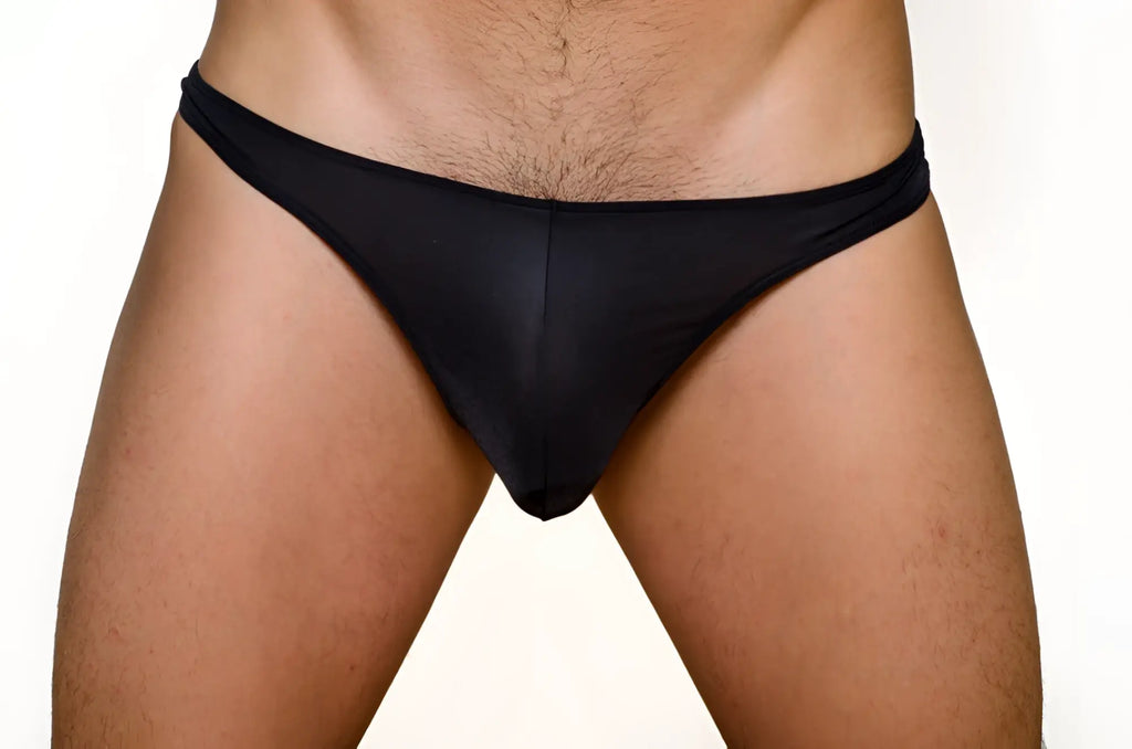 Black pride metro thong made of smooth stretchy fabric shown from the back in a 3 pack set