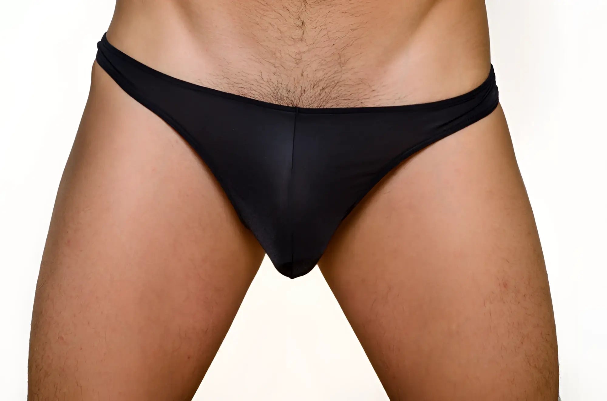 Black pride metro thong made of smooth stretchy fabric shown from the back in a 3 pack set