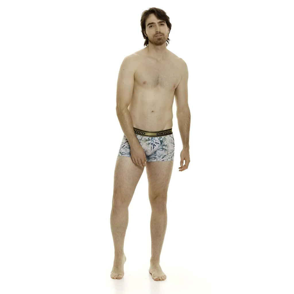 Men’s Unico 24020100105 Gasoleo trunks in white featuring light blue and white tropical leaf print with gold waistband