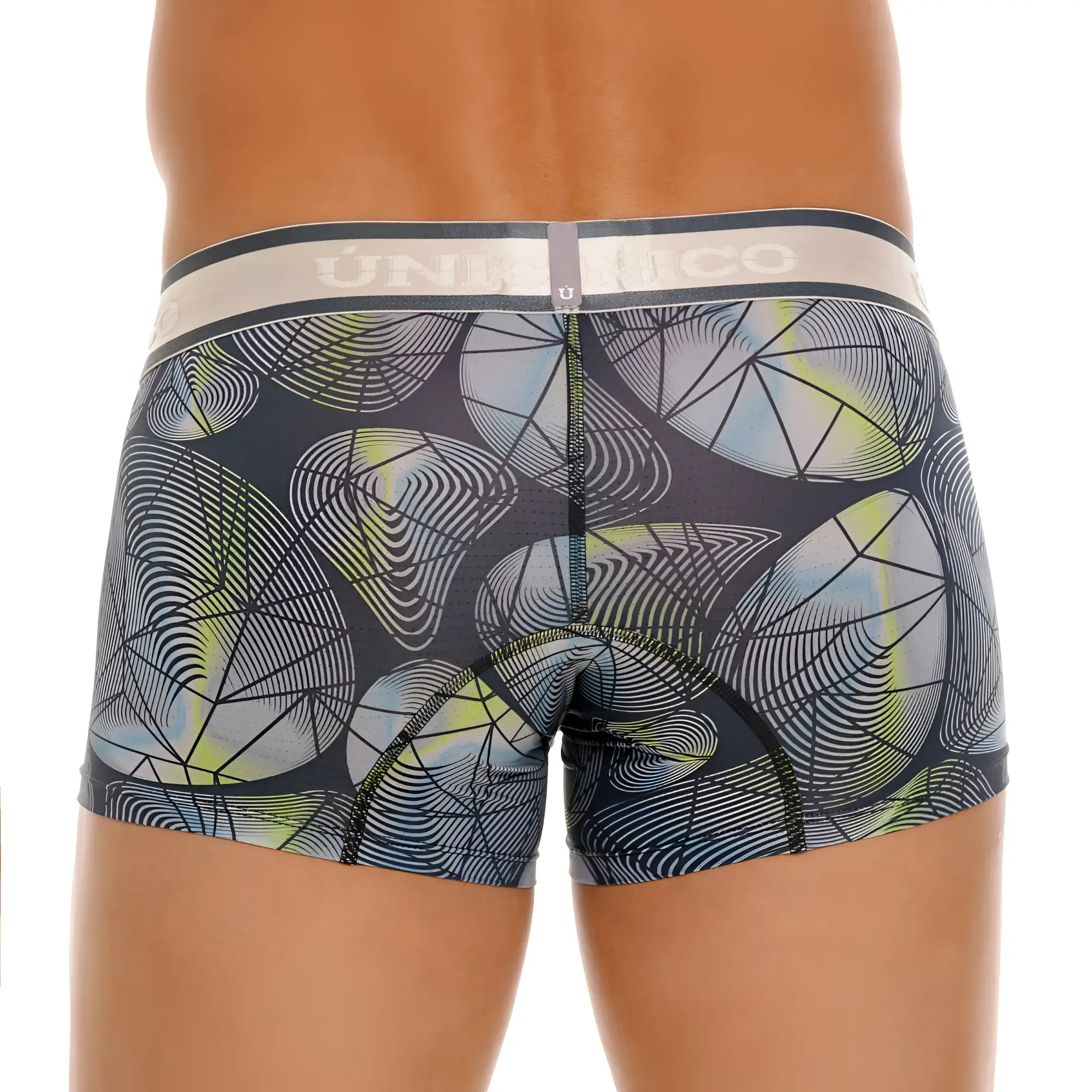 Dark gray unico resplandecer trunks with geometric pattern of light blue lime green and white overlapping circles