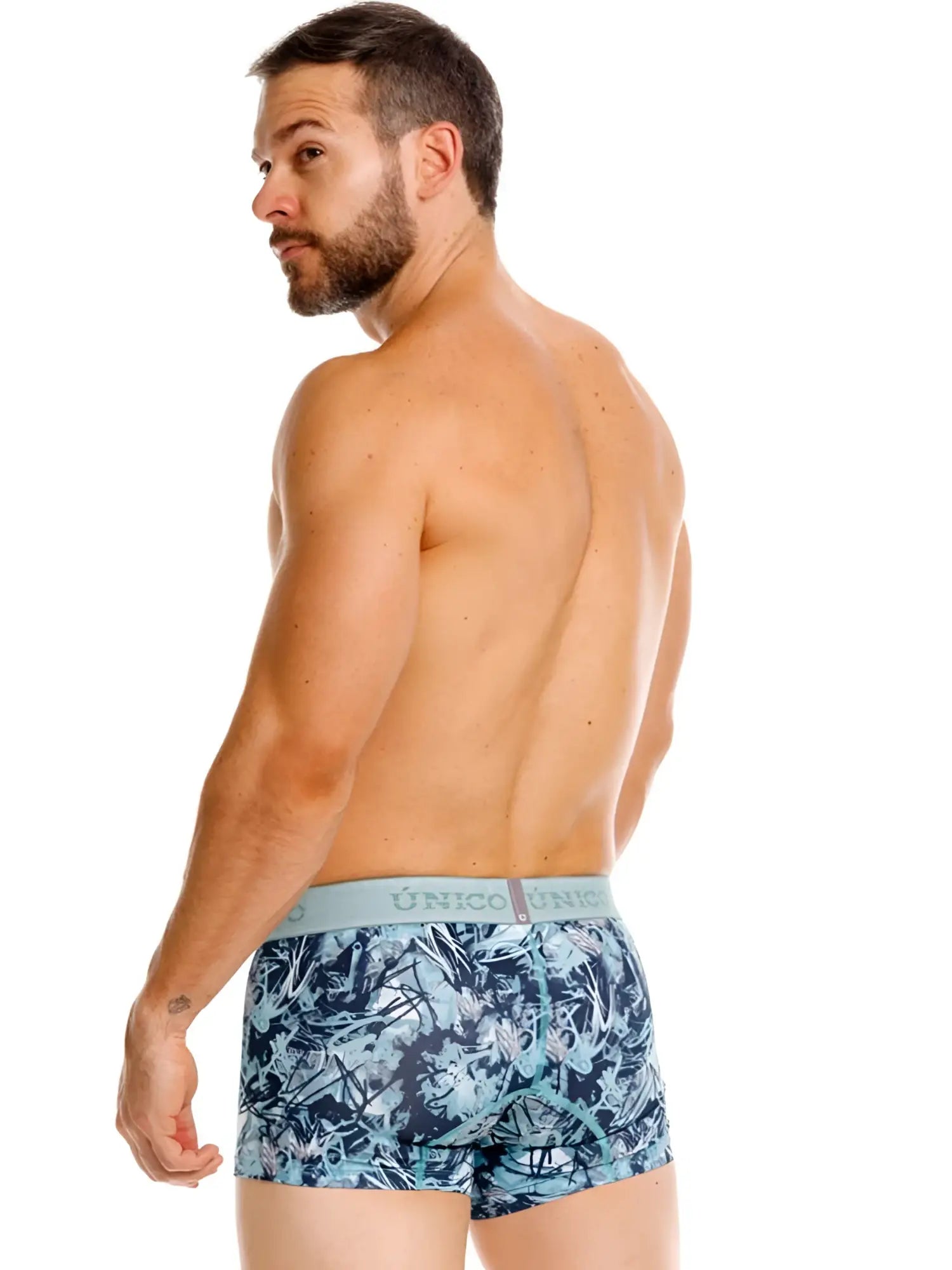 Blue and white tropical leaf patterned men’s boxer briefs with light gray unico waistband trunks color 43-blue