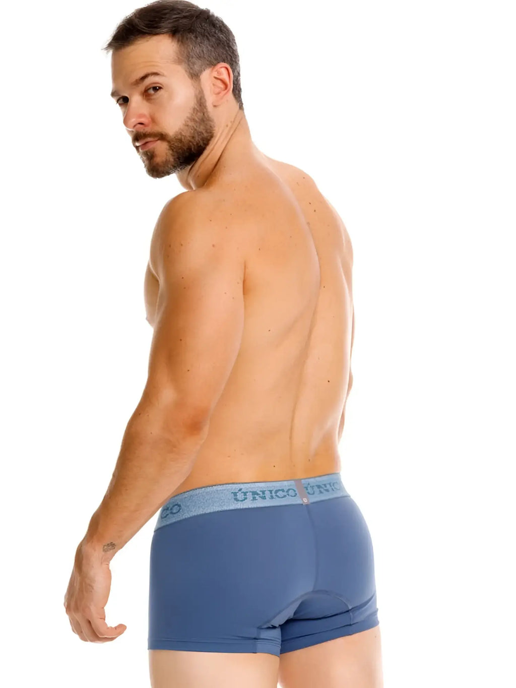Blue unico brand classic trunks with light blue waistband and unico logo in teal color for premium men’s everyday wear