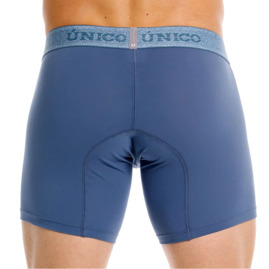 Blue unico men’s classic boxer briefs in teal with textured waistband featuring unico logo for premium comfort and style