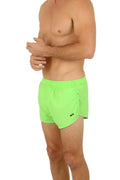 Bright neon green Uzzi running short featuring lightweight breathable fabric and a black logo on the left leg