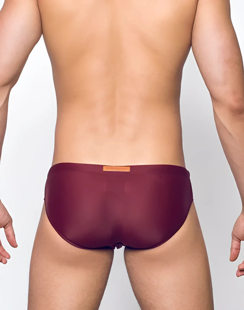 Maroon mesh briefs v10 core bikini with a small orange label at the waistband designed for comfortable everyday wear