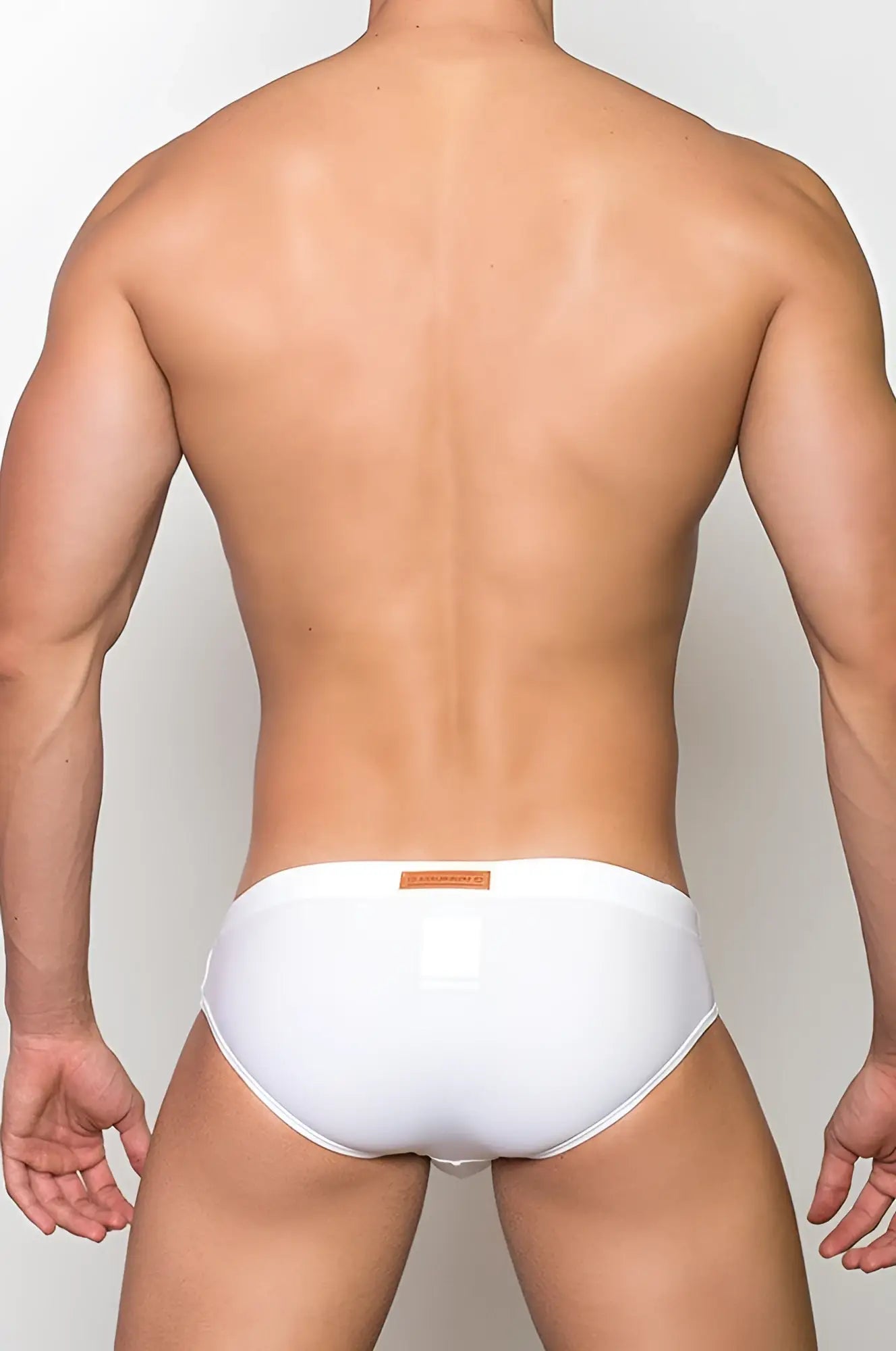 White v10 core bikini briefs with a small orange label on the waistband made from soft breathable fabric