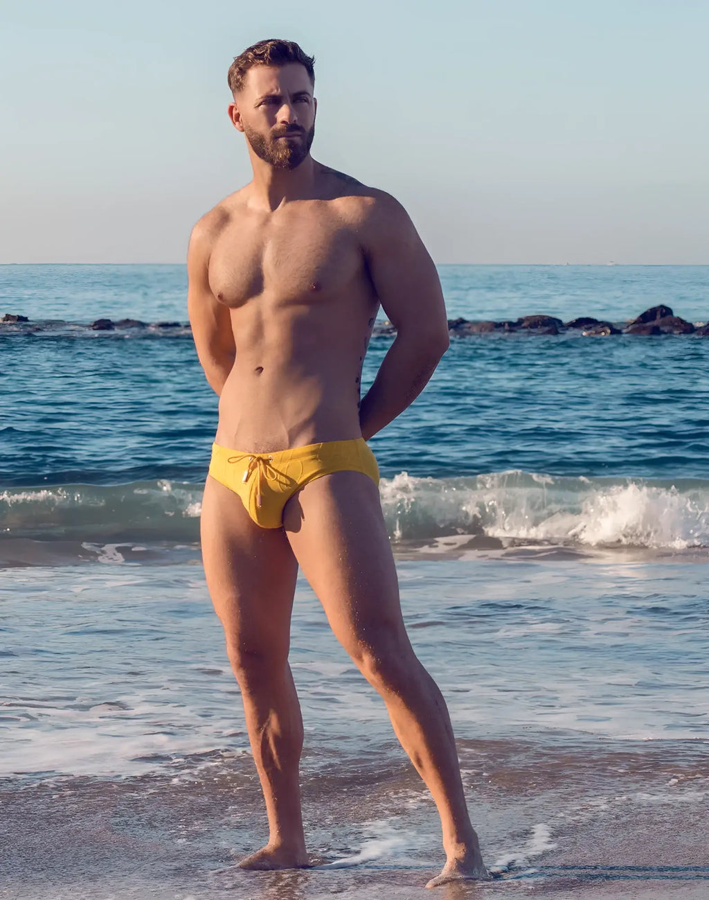 Bright yellow v10 ripple textured swim brief with drawstring waistband for comfortable beachwear and swimming