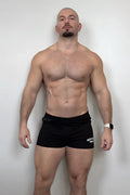 Black varsity 2 inch athletic shorts with zipper pocket and white logo on the left leg in midnight black color