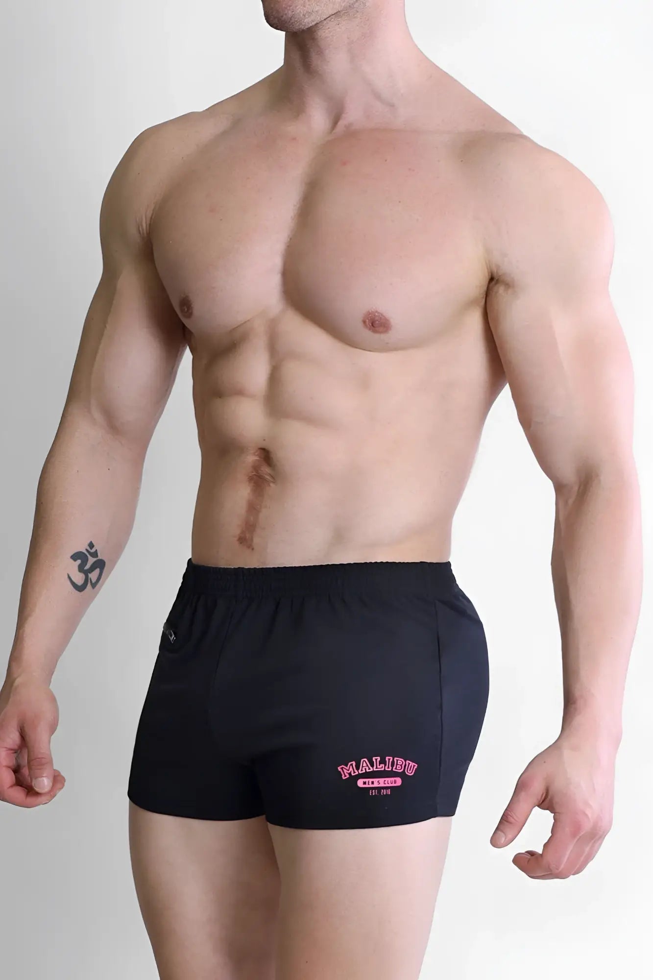 Black varsity 2 inch athletic shorts with pink malibu airsoft logo and zipper pocket for versatile use