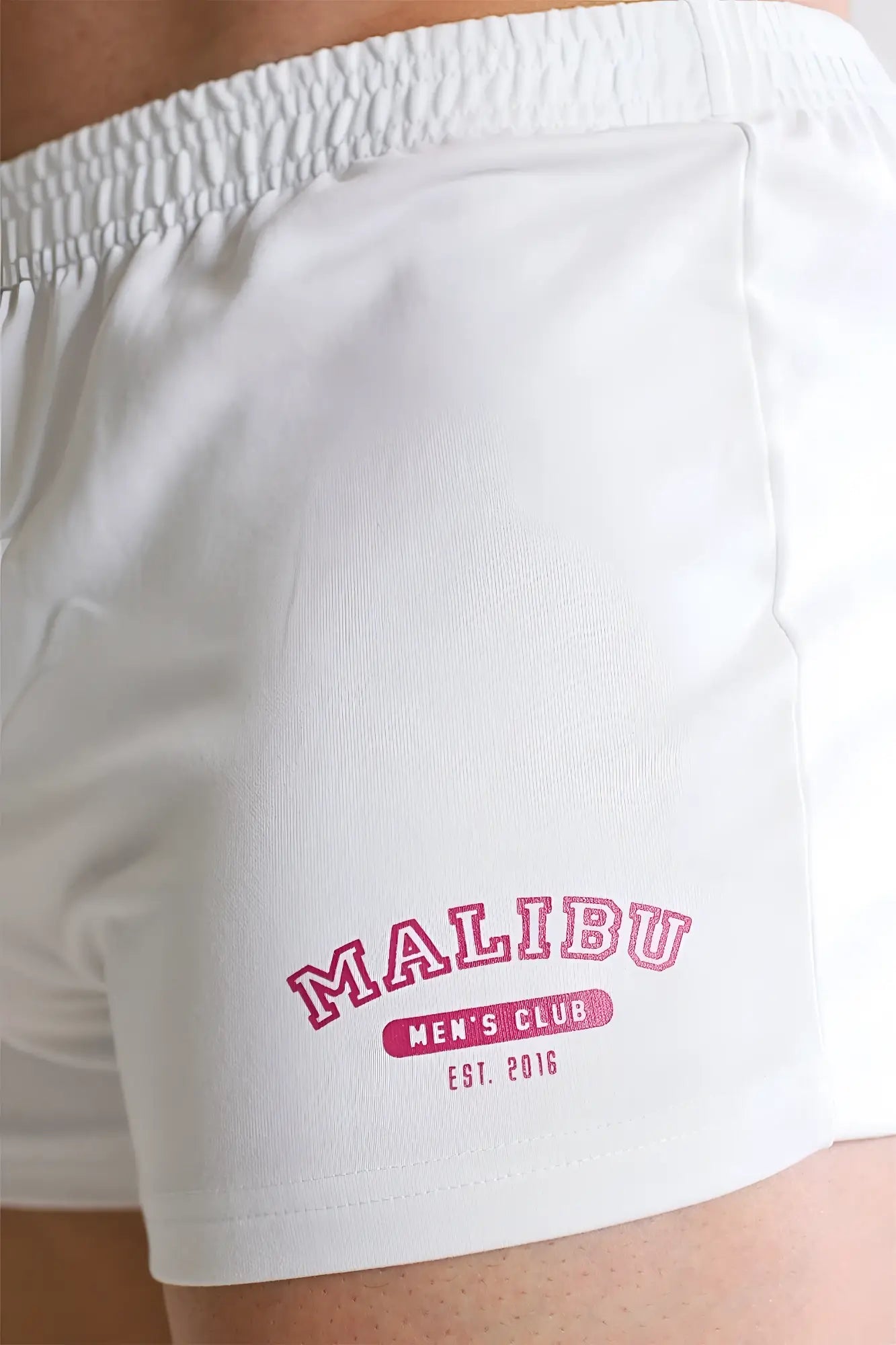 White varsity 2 inch athletic short shorts with zipper pocket pink malibu men’s club branding and red accent
