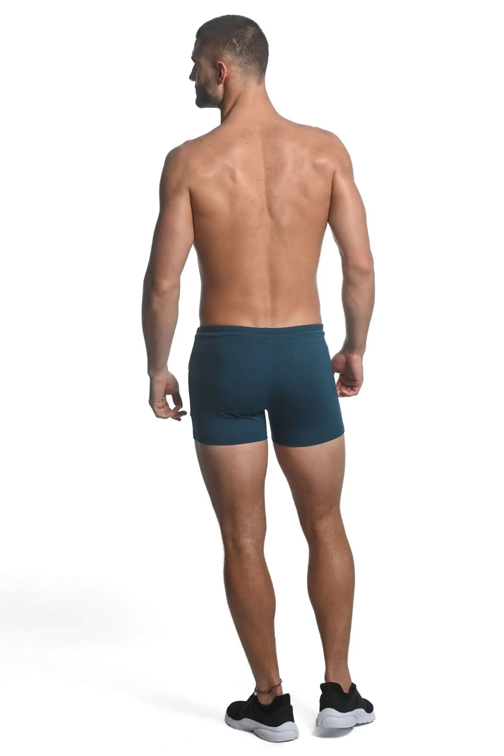 Dark teal vault gym-tech stretch shorts with heat weld zippers made from smooth form-fitting athletic fabric