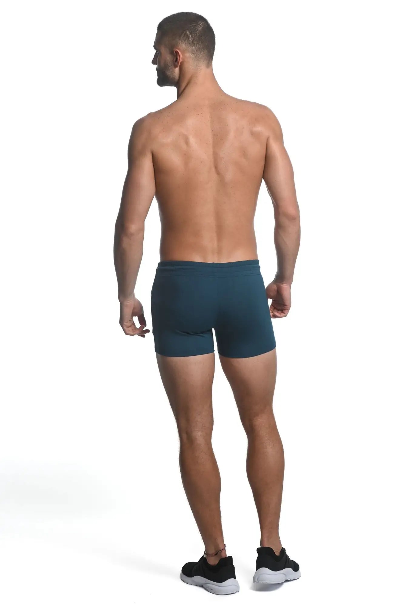 Dark teal vault gym-tech stretch shorts with heat weld zippers made from smooth form-fitting athletic fabric