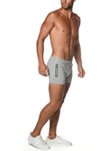 Gray vault gym-tech stretch shorts with black heat weld zippers on the side for athletic use