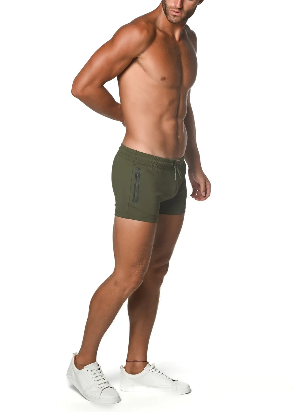 Olive green vault gym-tech stretch shorts with heat weld zippers, side zipper pocket, and drawstring waistband