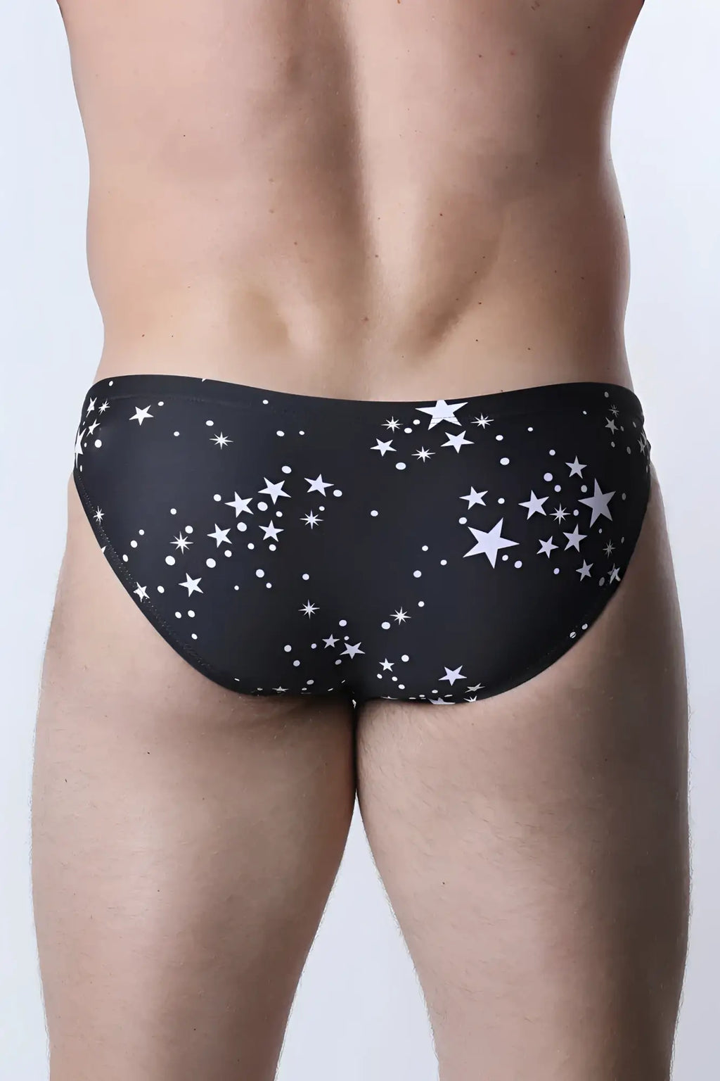 Black pulse swim brief with white star and dot pattern swim trunks designed for comfortable beachwear
