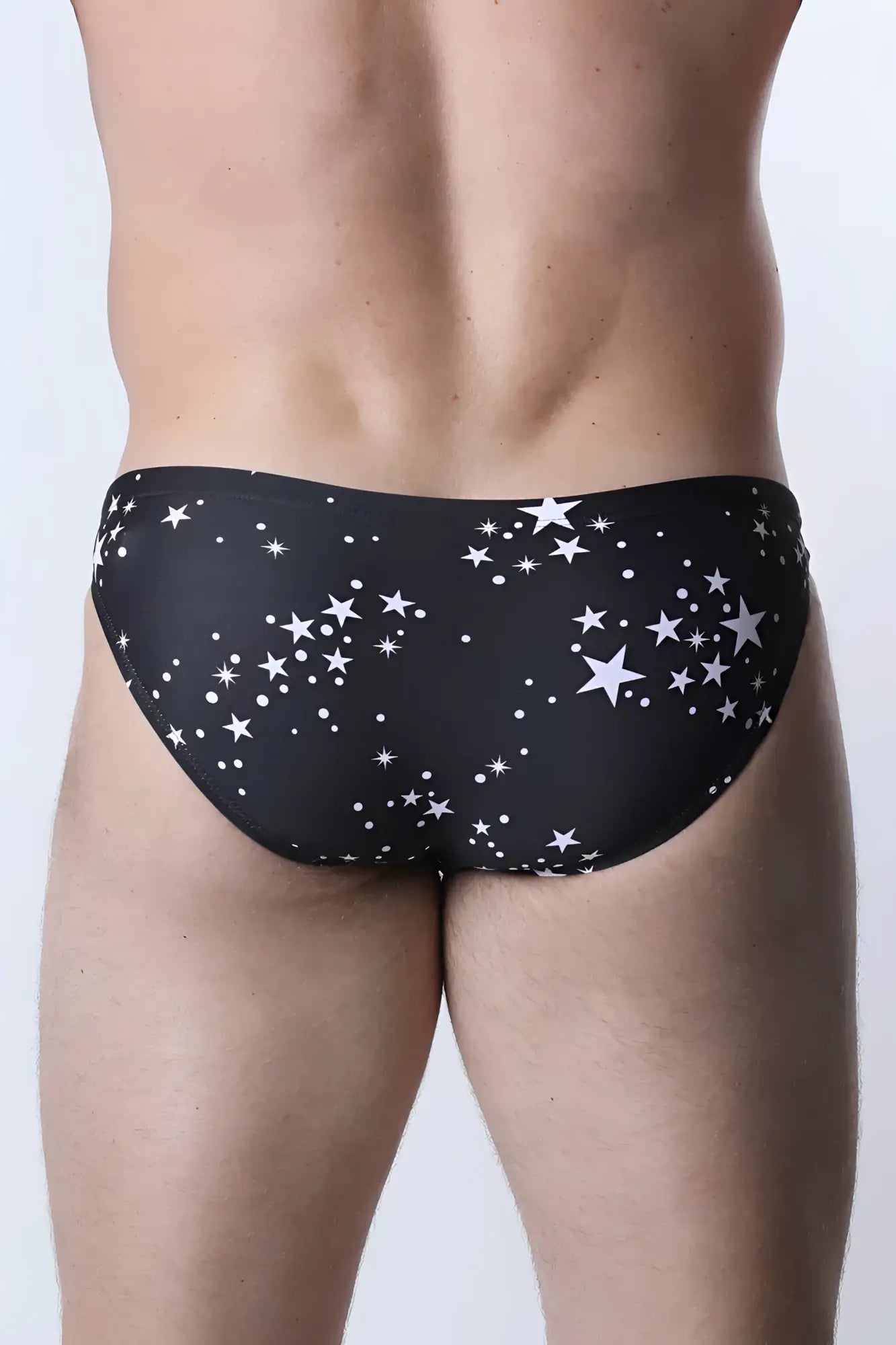 Black pulse swim brief with white star and dot pattern swim trunks designed for comfortable beachwear