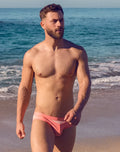 Vb13 swim brief pink swim trunks with subtle white stripe detail perfect for beachwear and poolside use