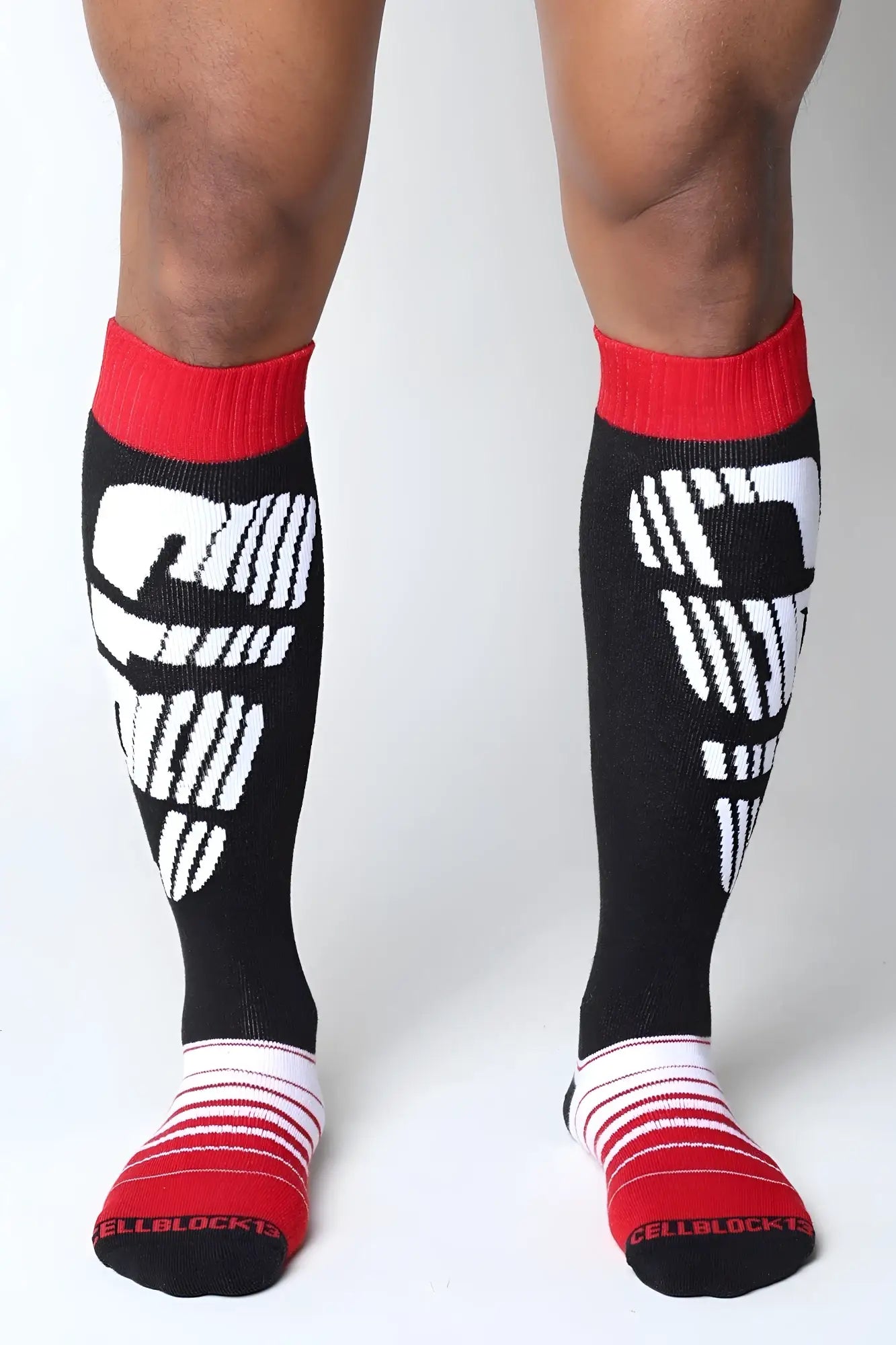 Black knee high socks velocity 2.0 with cellblock 13 logo white graphic and red ribbed cuffs and toes