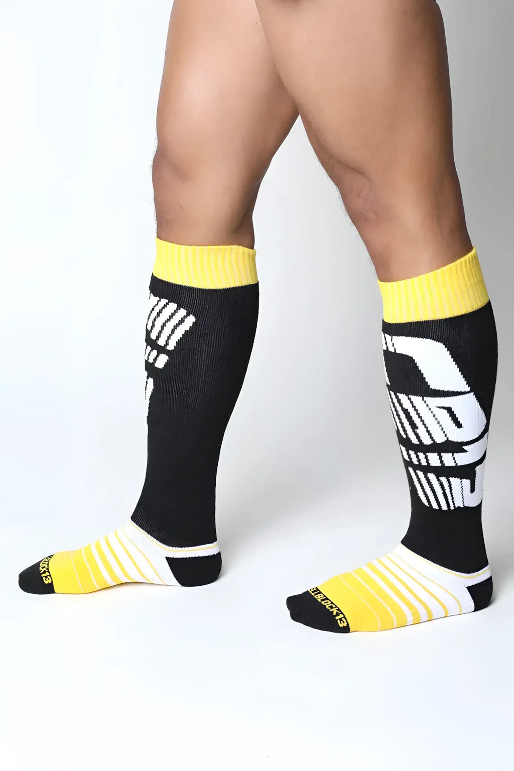 Black and yellow velocity 2.0 knee high socks with bold white graphic design in three colors to choose from