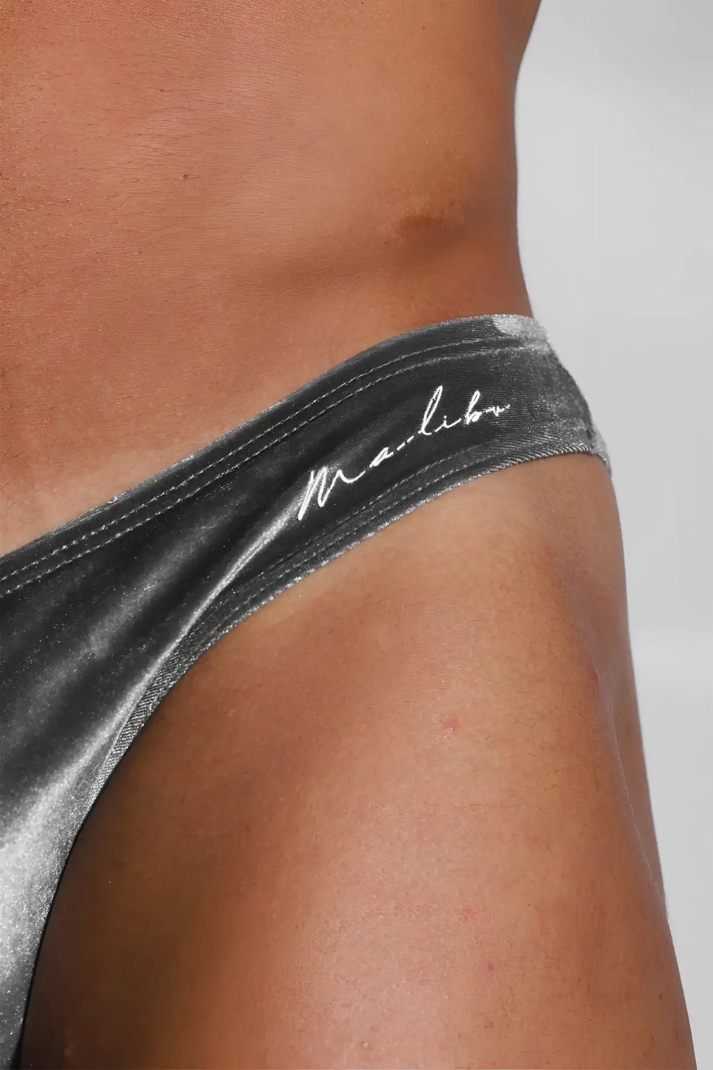 Velvety scrunch-butt bikini briefs in fossil grey featuring a silver metallic bottom with marlboro logo embroidery