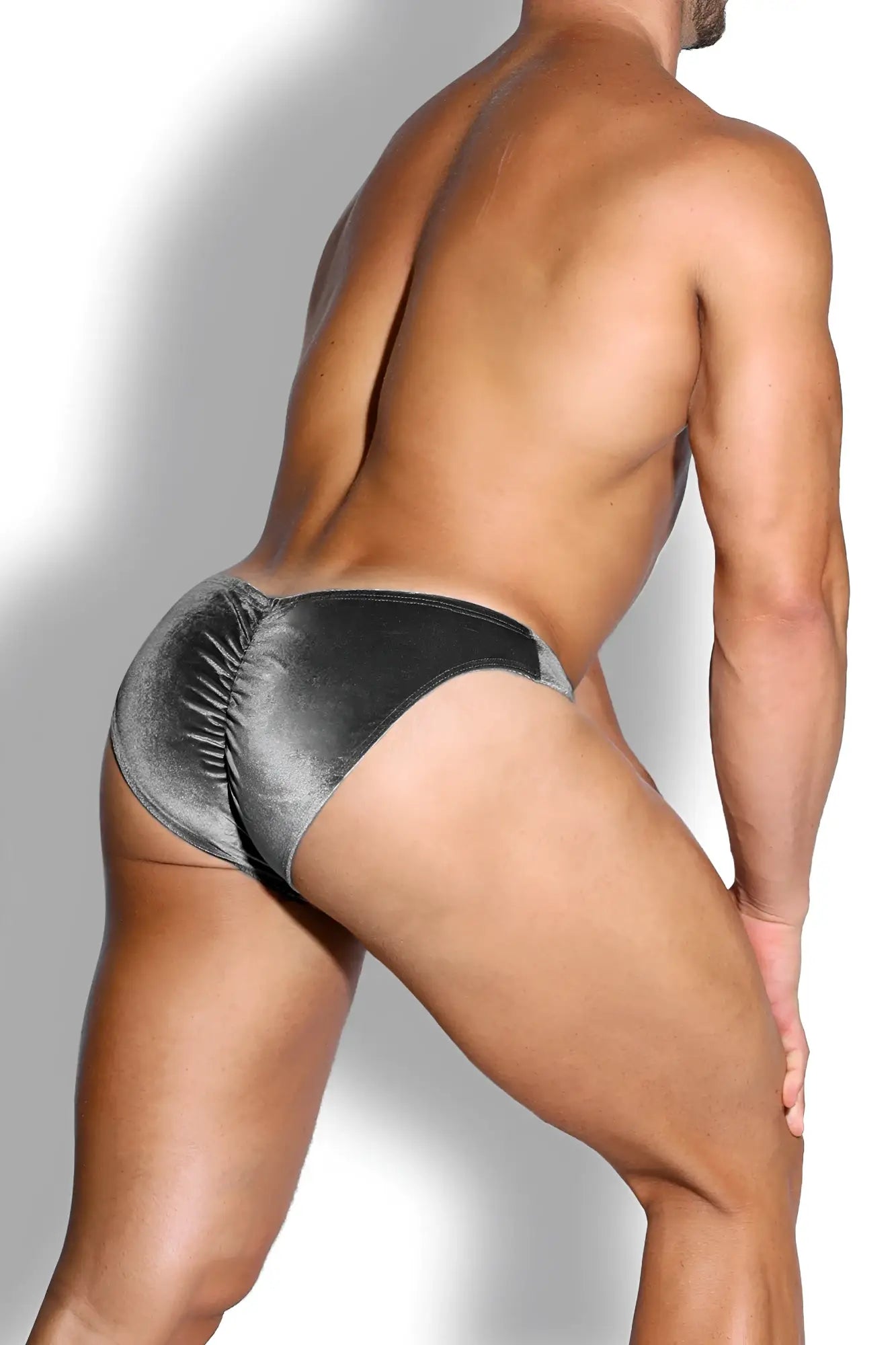 Silver velvet bikini briefs with ruched back and black trim shown from the back in fossil grey velvety scrunch-butt style