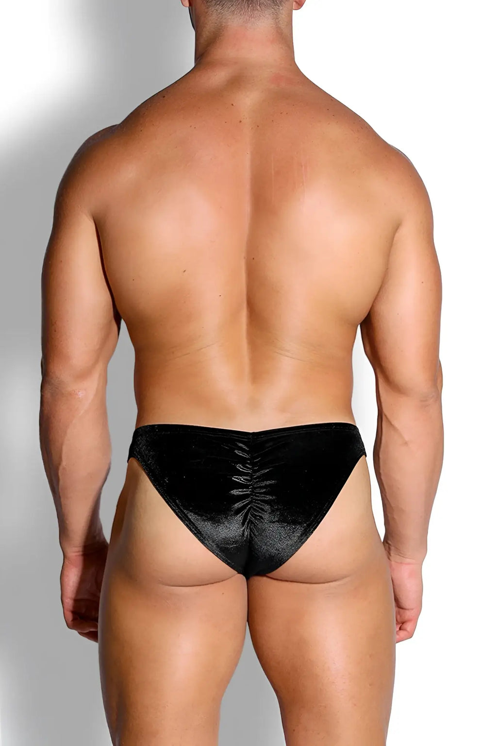 Black velvet velvety scrunch-butt bikini briefs with ruched back design in onyx black shown from the back side