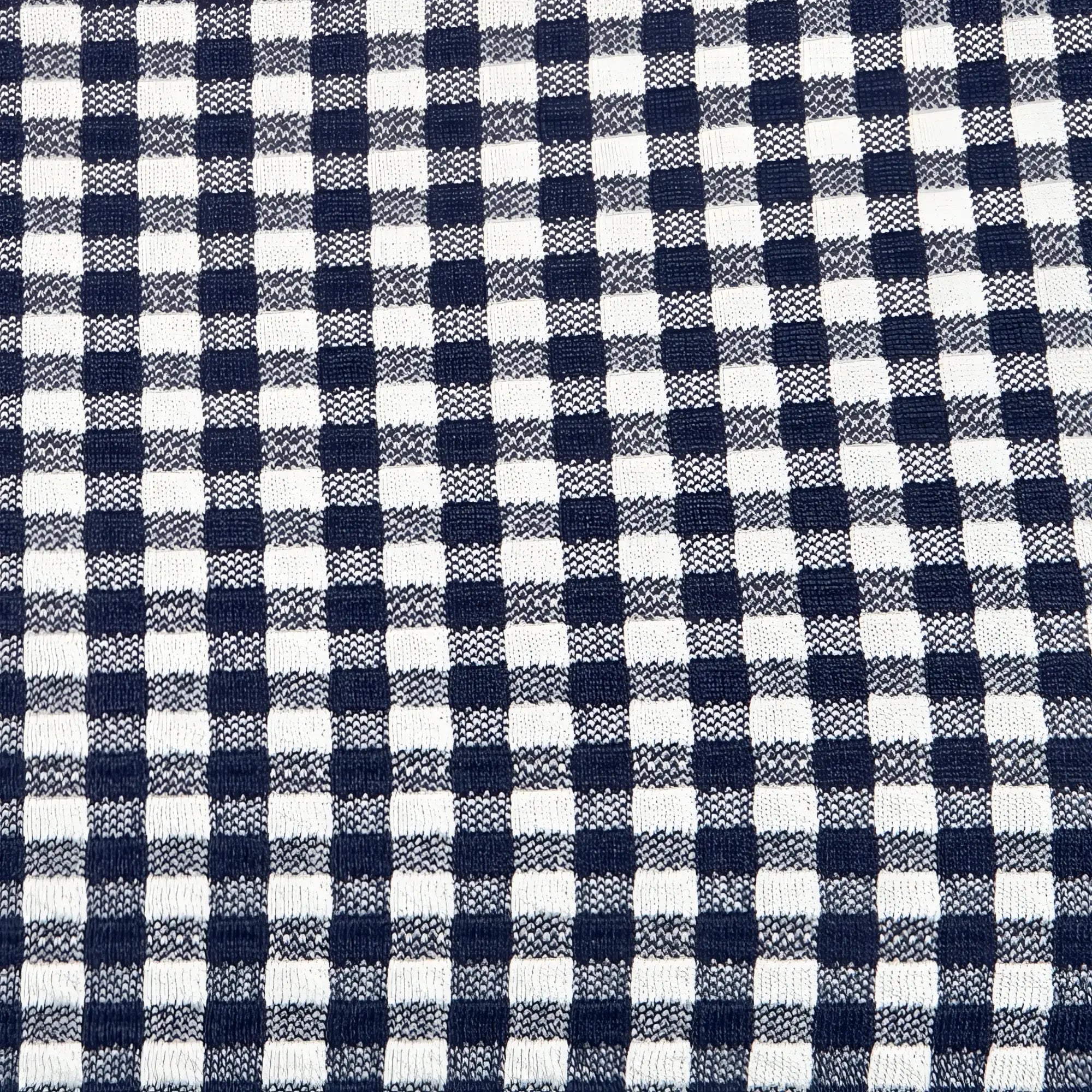 Navy blue and white gingham print vichy swim bikini brief with classic checkered pattern visible on fabric surface
