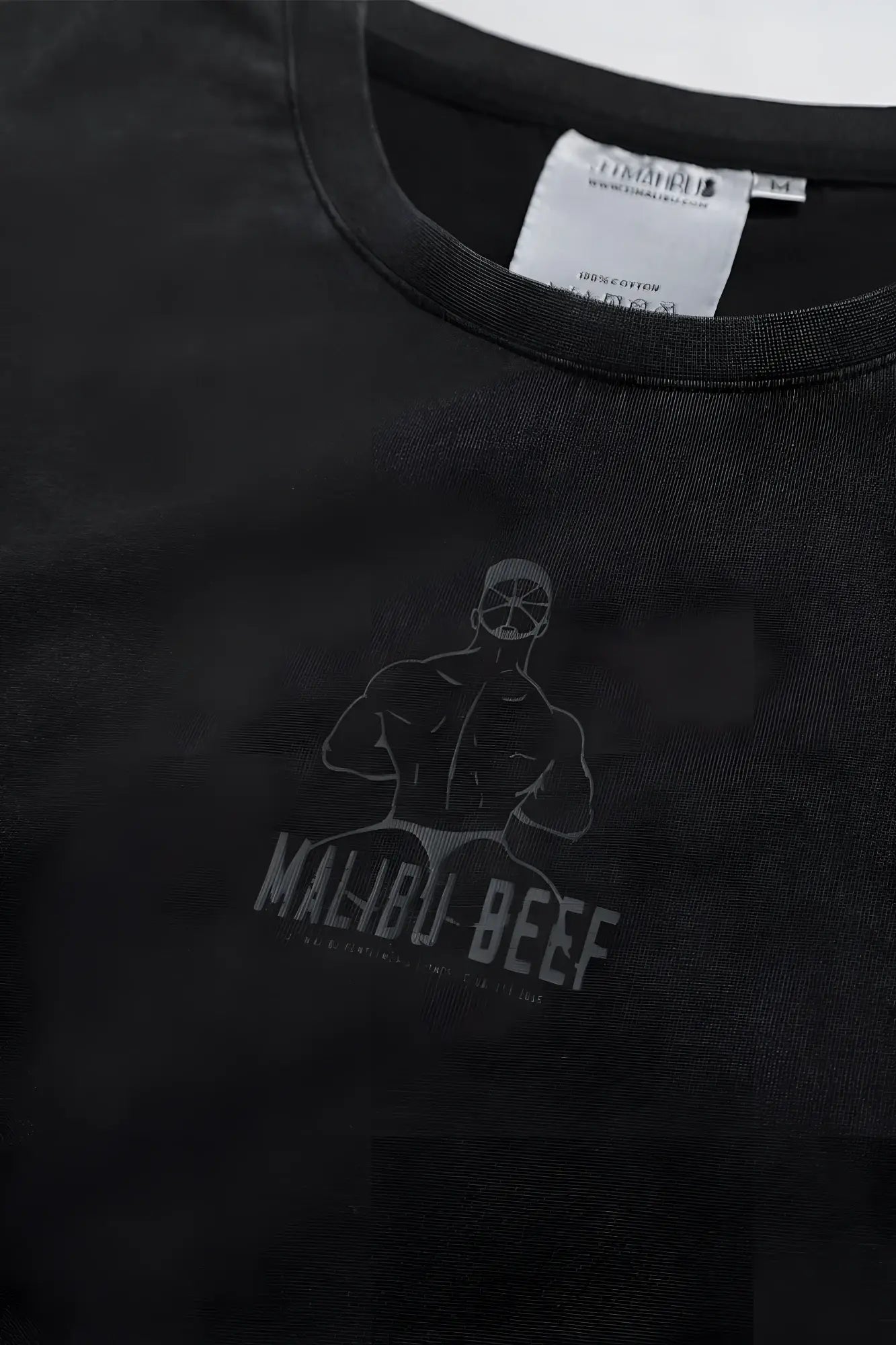 Black cotton vintage-washed drop-shoulder crop tee with faded gray malibu beef muscular figure graphic