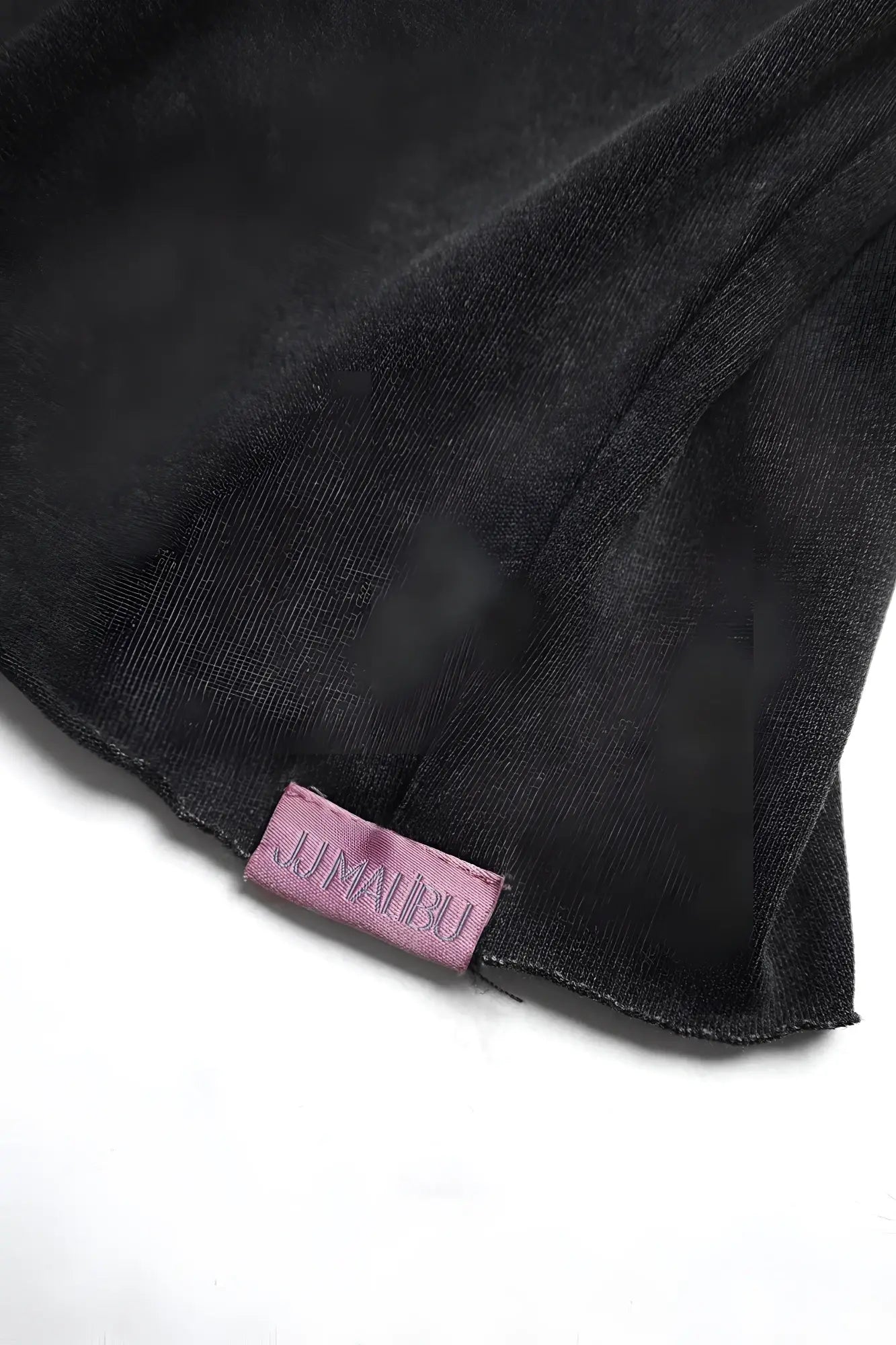 Black vintage-washed drop-shoulder crop tee with textured fabric and small pink lunarbu woven label on front