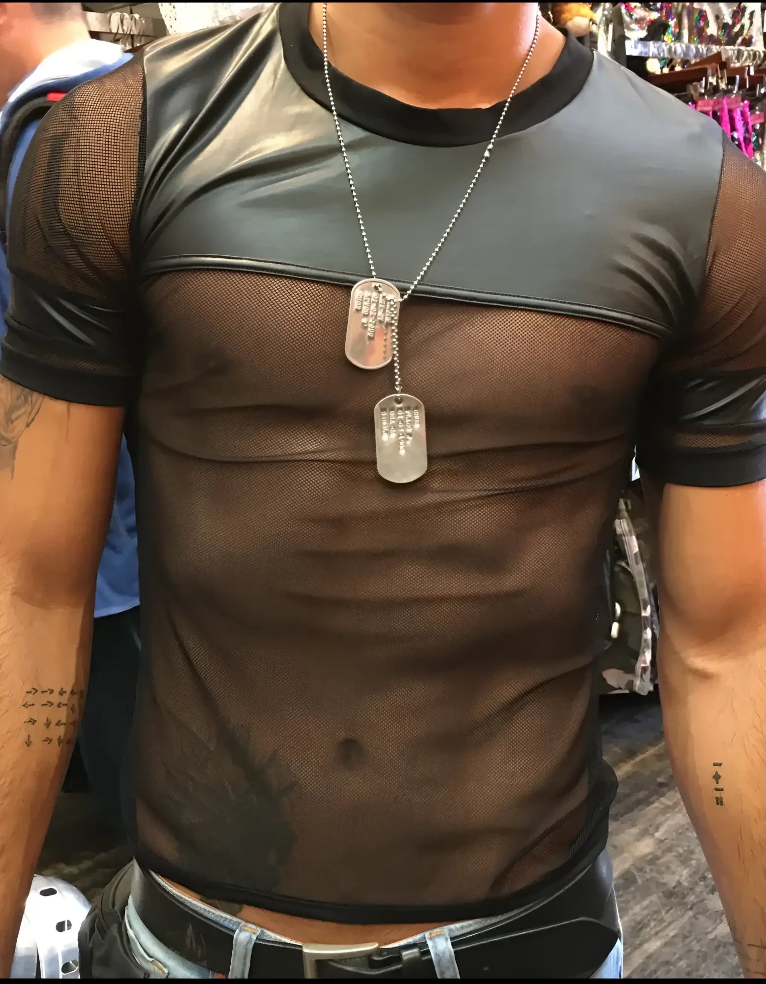 Black mesh short-sleeved vinyl and mesh tee with faux leather panels on shoulders and chest