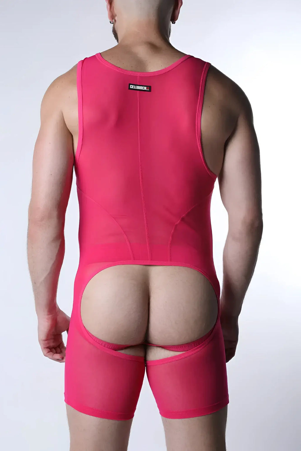 Bright pink sheer mesh void mesh body suit showing back side with distinctive rear cutout design