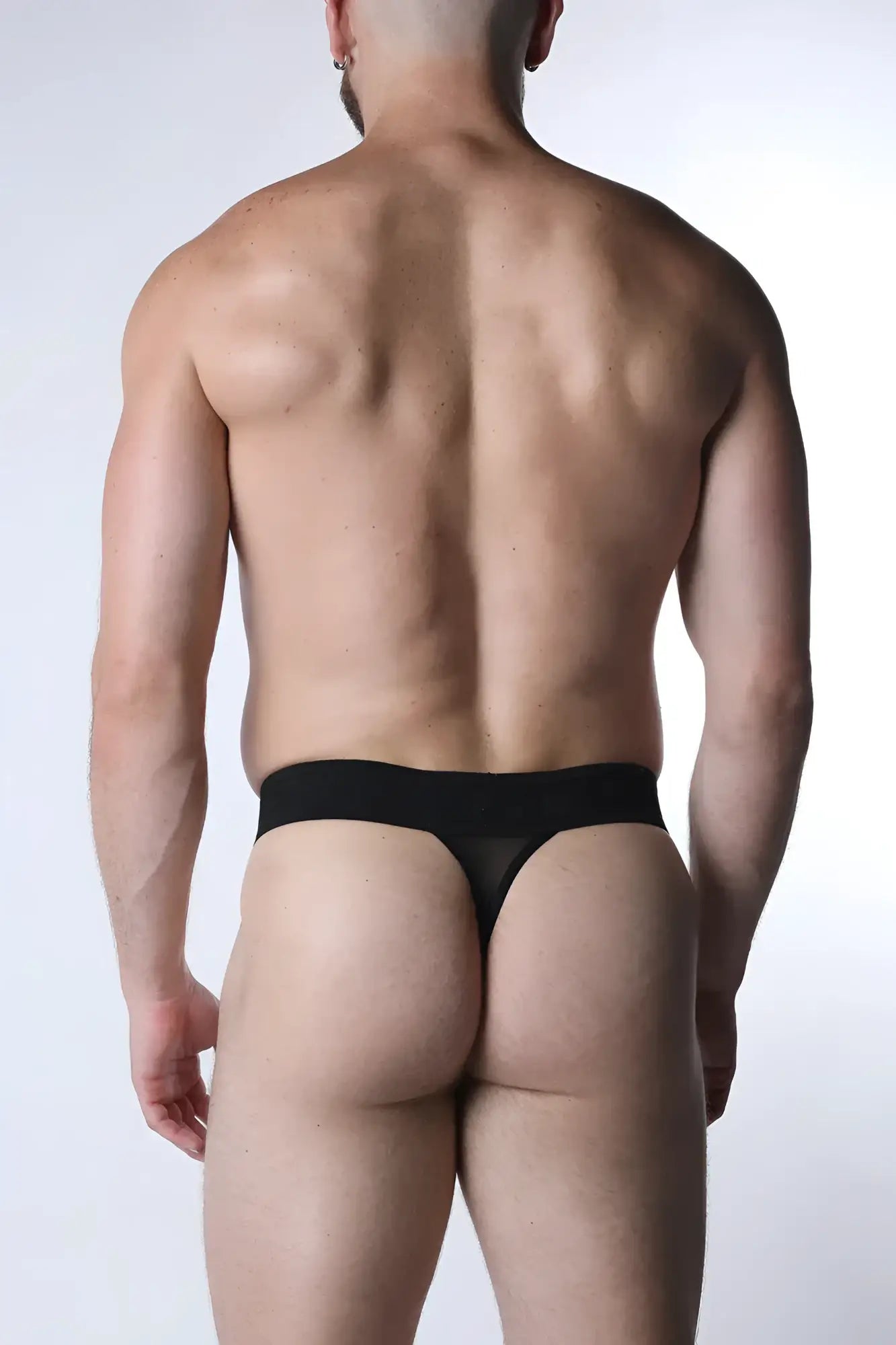 Black sheer mesh thong with solid waistband from Void Mesh Thong collection shown from back side