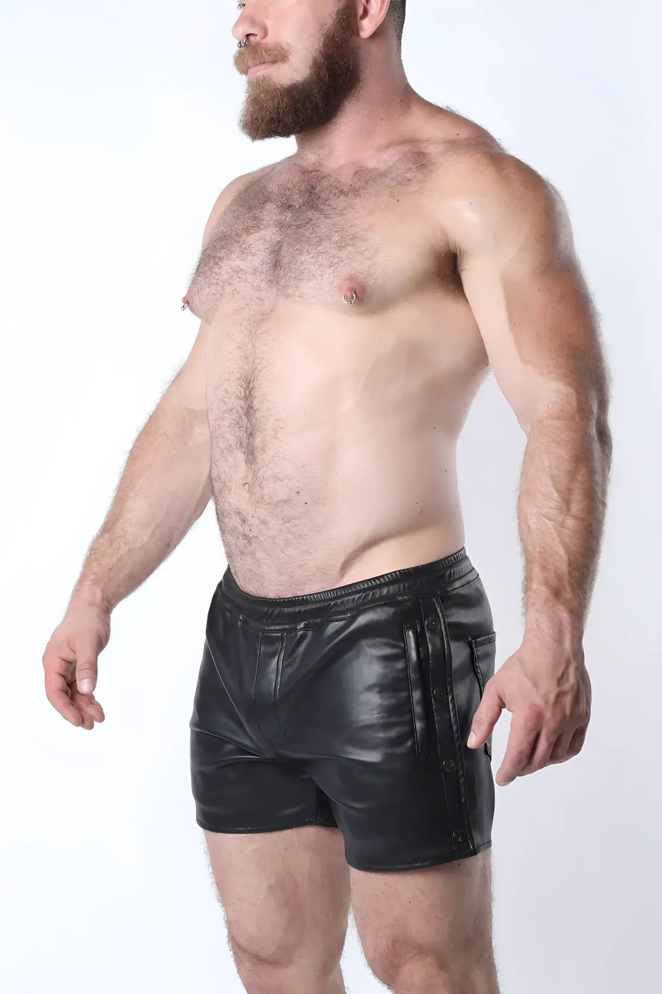 Black leather void snap up shorts with glossy finish and side pockets featuring vertical zipper details