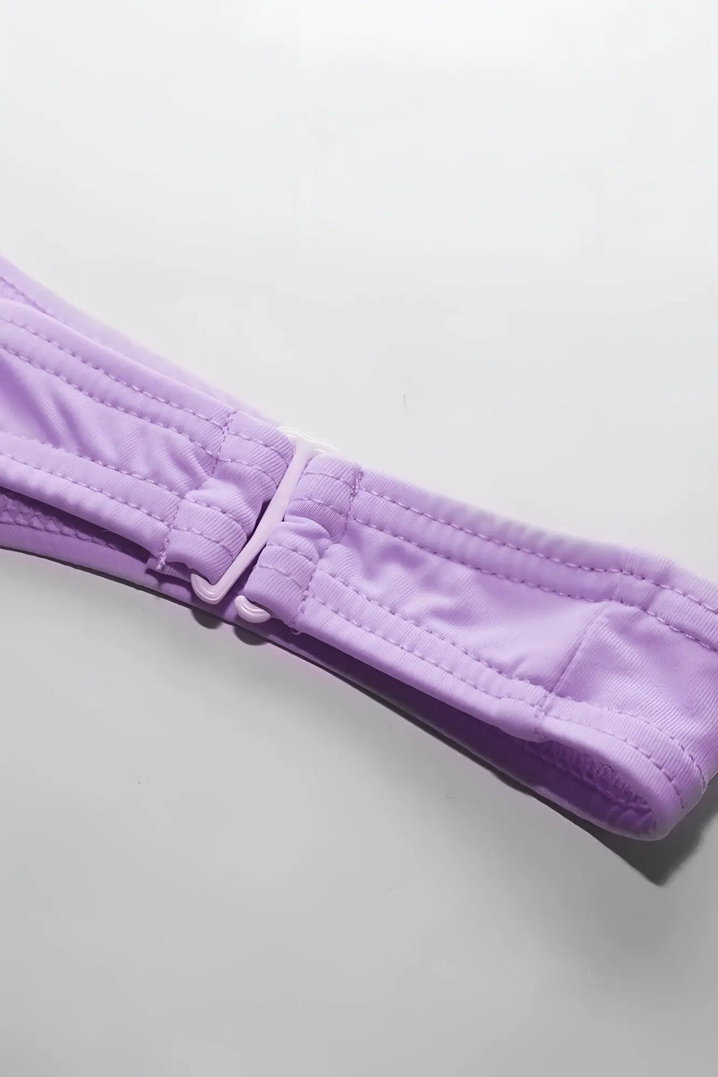 Lavender quilted fabric strap with matching plastic buckle on voyage low cut swim bikini briefs for men