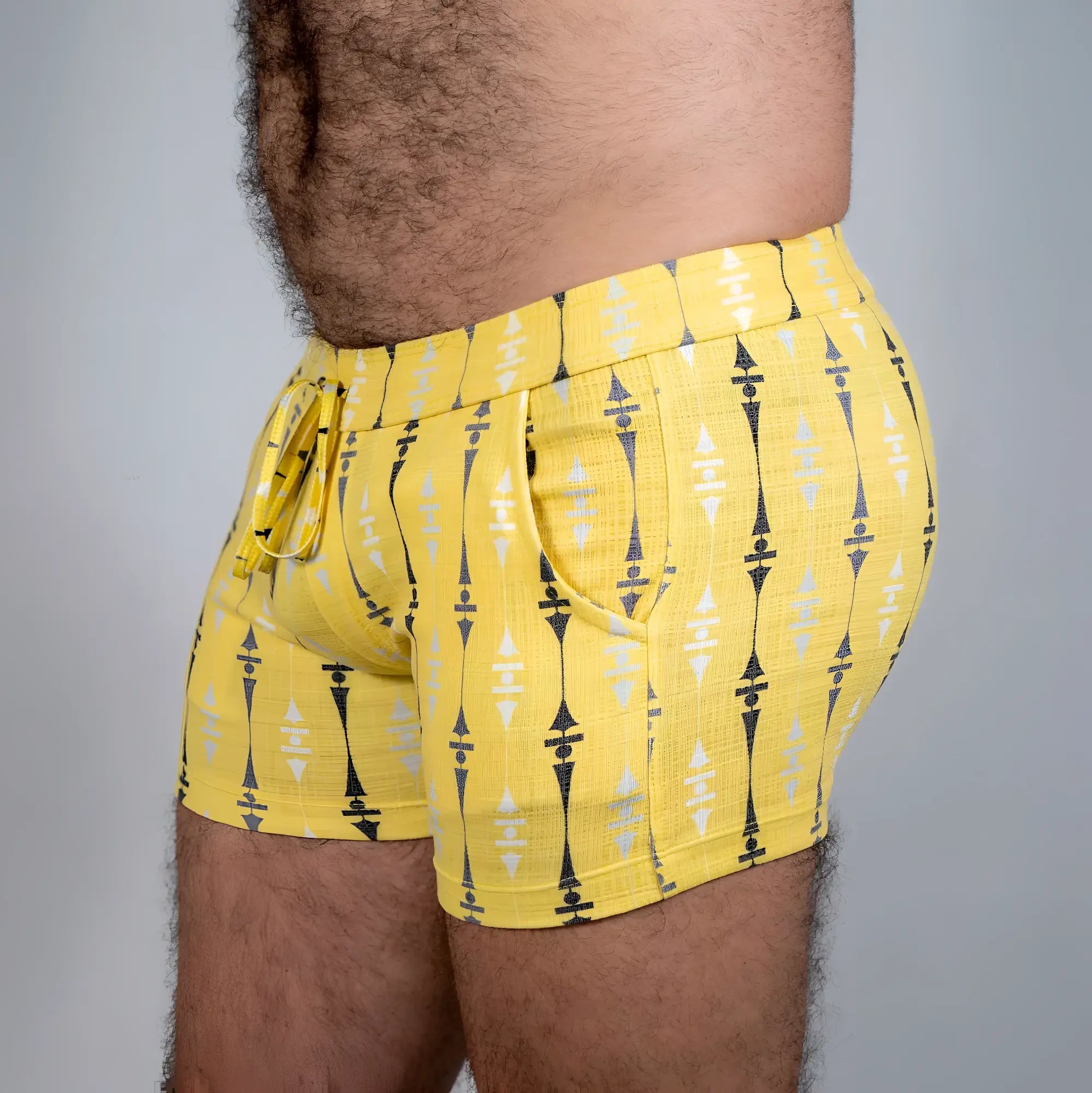 Bright yellow wallpaper print linen texture shorts with bold black and white geometric pattern elastic waistband and pockets