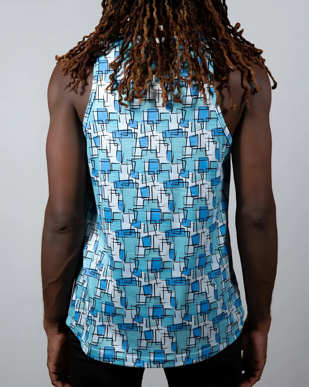 A blue and white sleeveless tank top with geometric wallpaper print perfect for casual summer wear