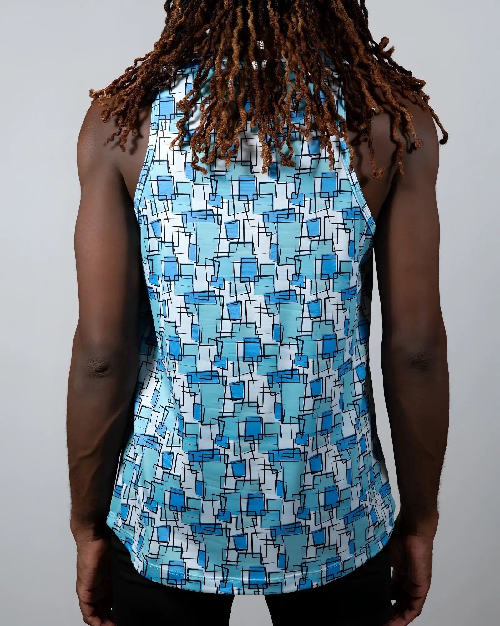 A blue and white sleeveless tank top with geometric wallpaper print perfect for casual summer wear