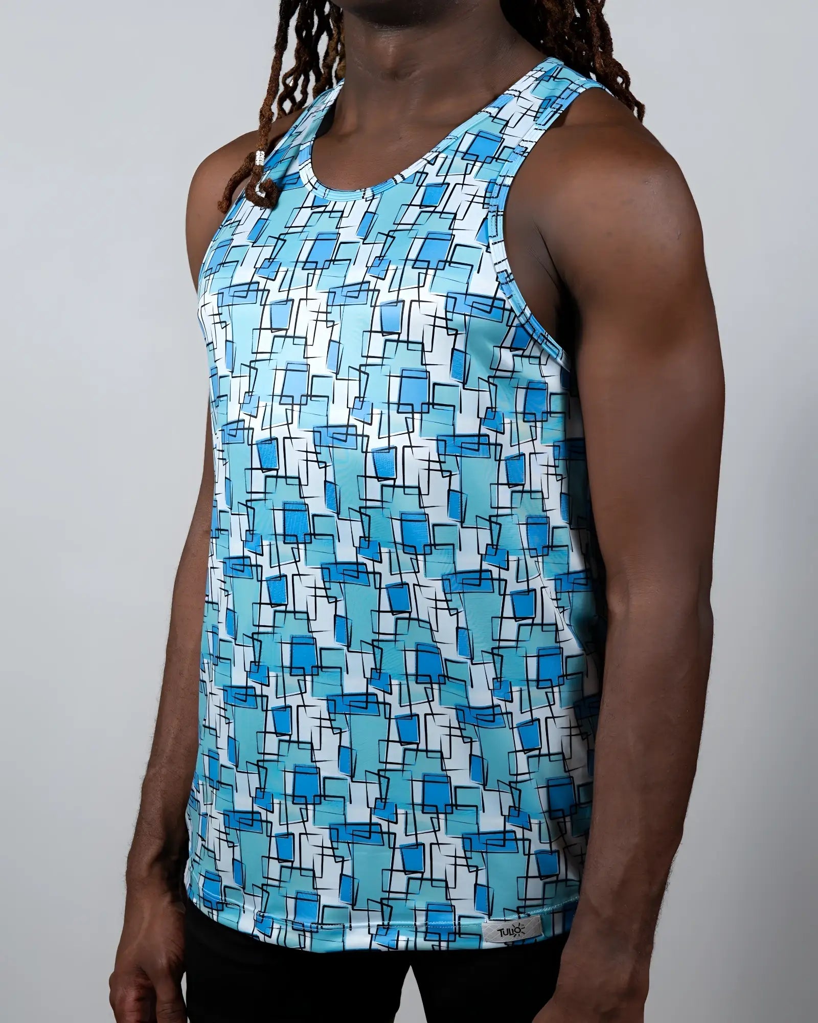 A men’s wallpaper print tank top with overlapping blue squares on white lightweight fabric