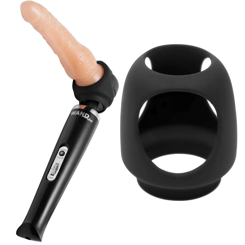 Wand Essentials Strap Cap harness attachment in black silicone, shown with a wand massager and skin-toned dildo.