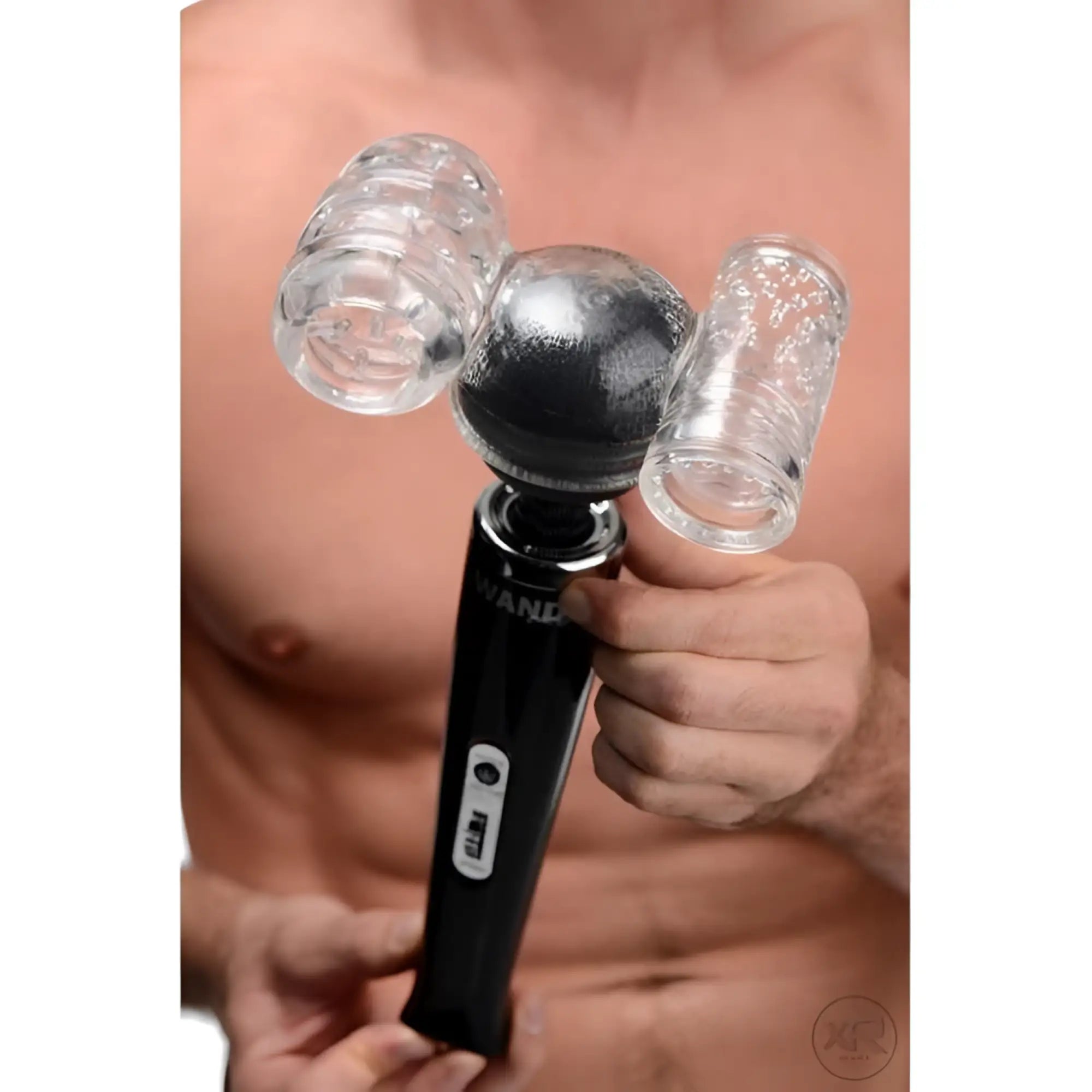 Wand Essentials Twin Turbo Strokers wand attachment in black, featuring two clear, textured stroking sleeves.