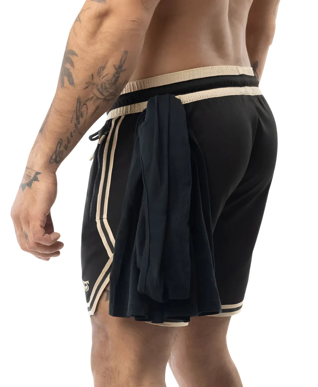 Warm up rugby shorts in black with cream stripes and drawstring waistband featuring a side fabric flap