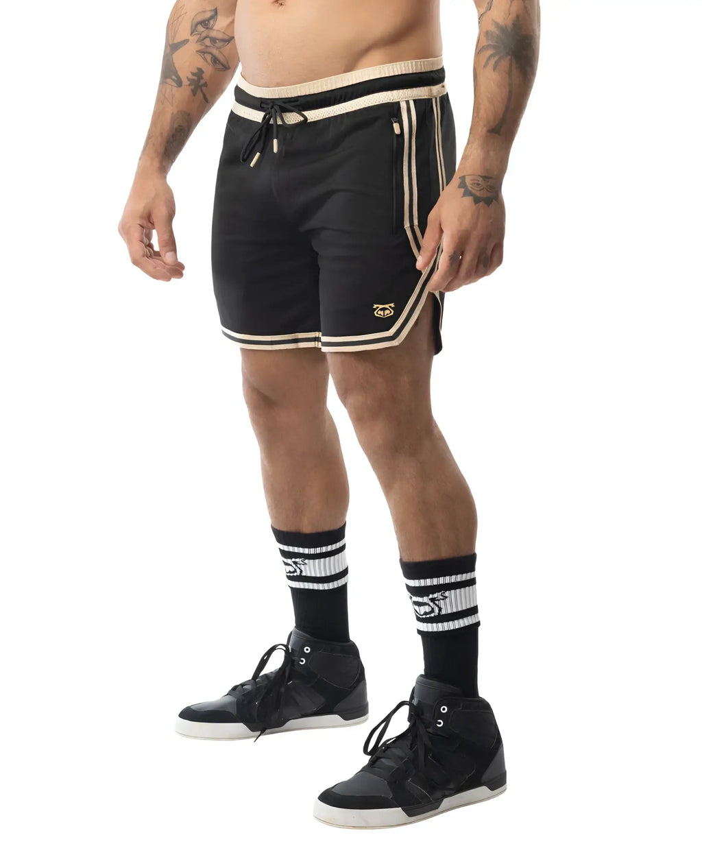 Black warm up rugby shorts with cream trim and side stripes featuring a small embroidered logo on the lower left leg